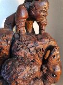 Statut en bois homme sur bête en bois sculpté