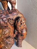 Statut en bois homme sur bête en bois sculpté